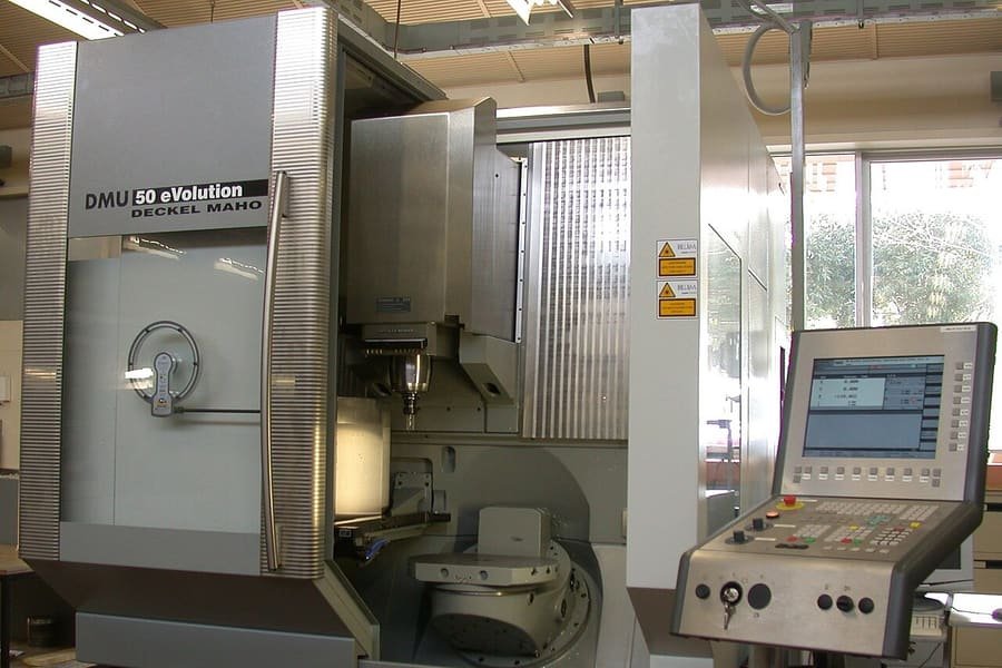 CNC machining center with control panel in a workshop
