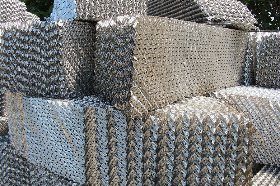 Stacked structured packing modules for process columns