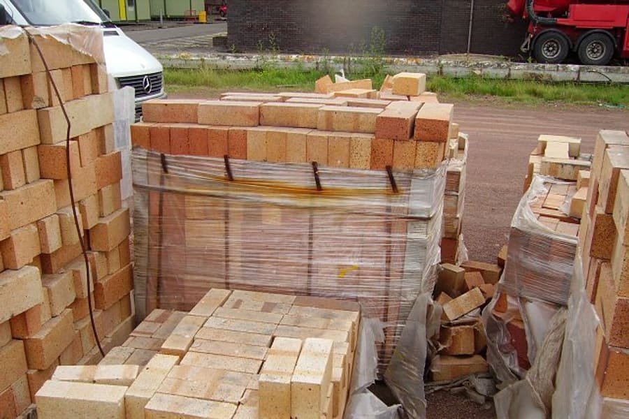 Pallets of refractory fire bricks wrapped for transport