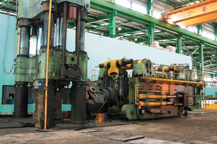 Heavy hydraulic press in an industrial workshop