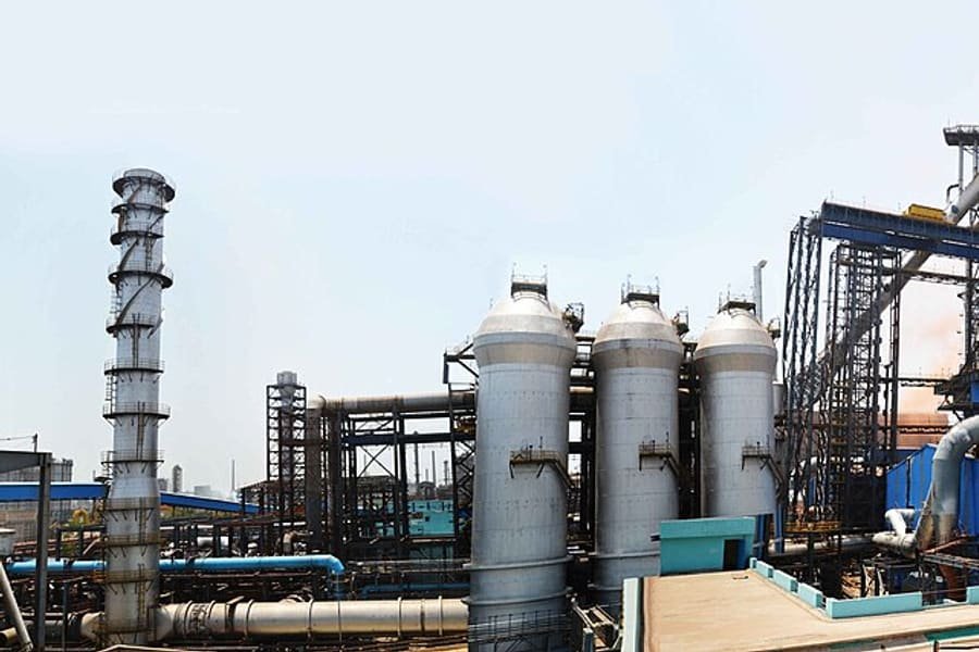 Large reformer and furnace structures at an industrial plant